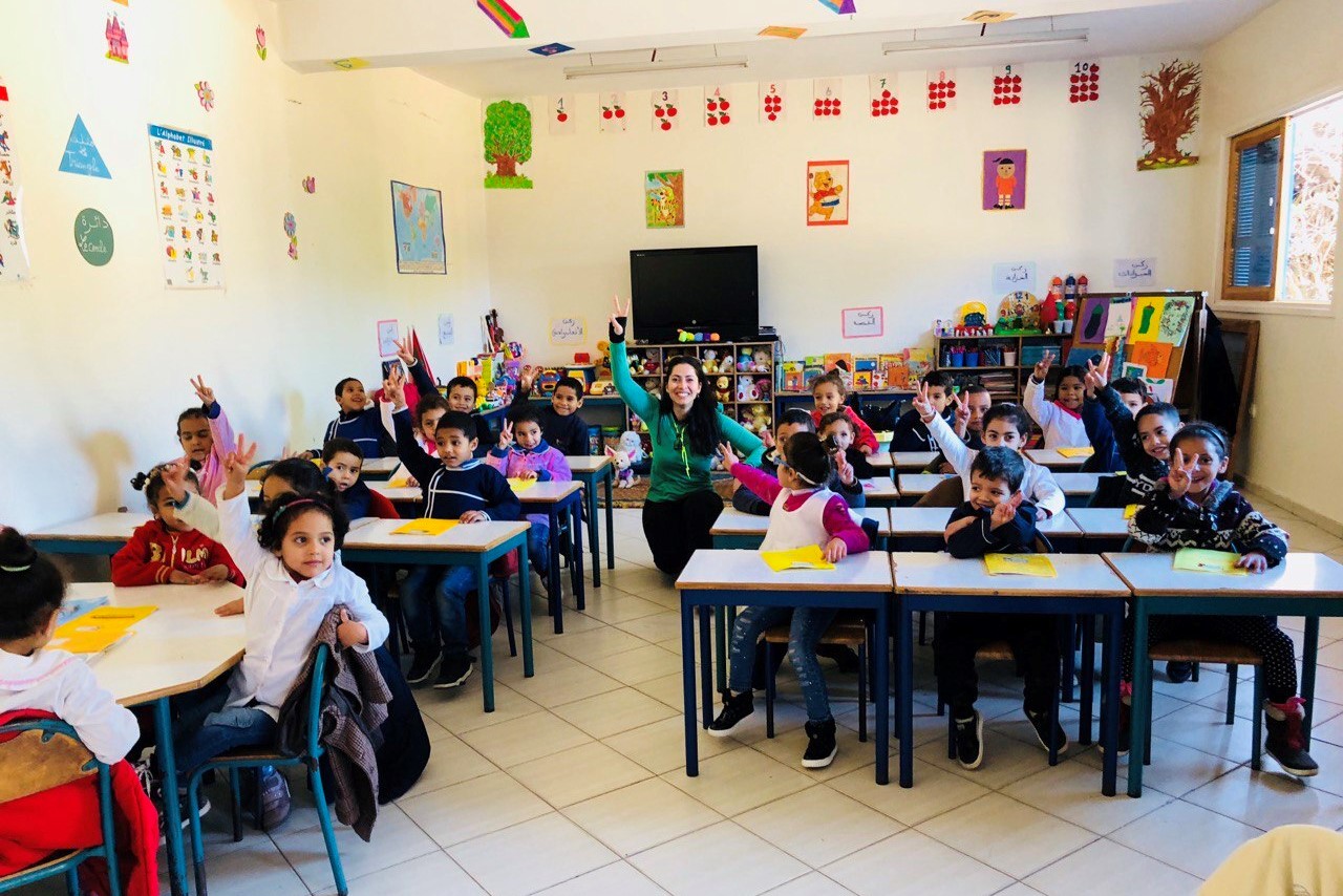 CEO Hiba Badran with school children